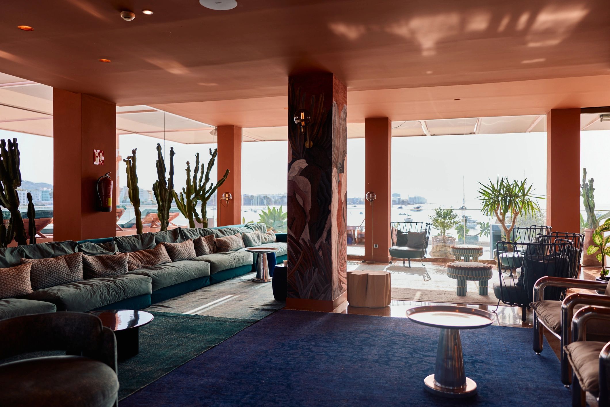 Modern resort lobby with stylish furniture and sea view